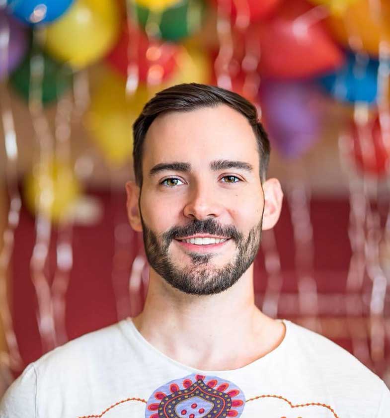 Mr. Gay Germany Enrique Doleschy with balloons